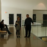 Project manager Ryan Miller speaks to journalism student Caitlin Flack on the second floor of the building.